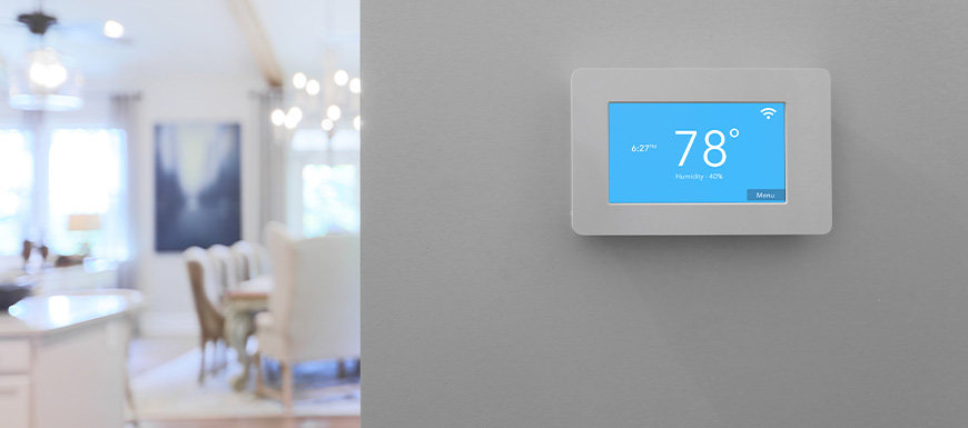 Smart thermostat on a wall